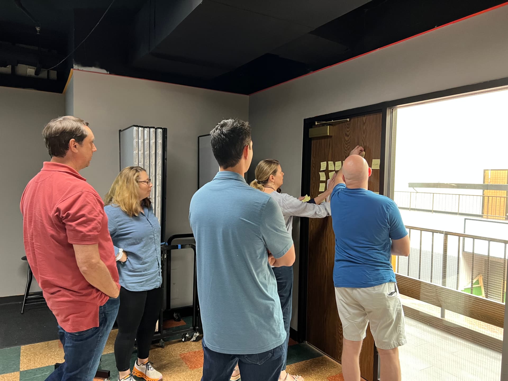 Cross-functional leaders mapping how strategic priorities affect teams and delivery.